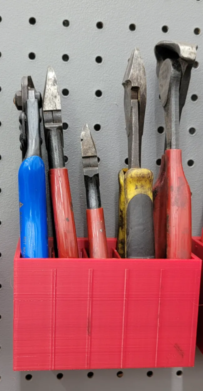 Cutting plier holder for peg board.