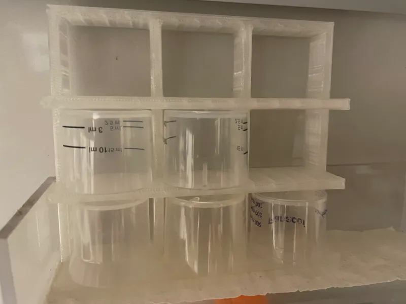 Medicine measuring cup holder