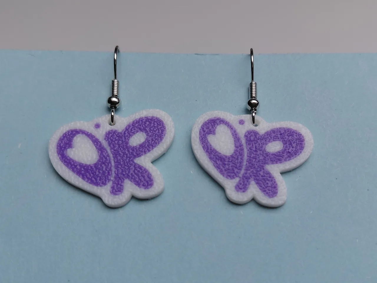 Olivia Rodrigo logo earrings / keychain view 4