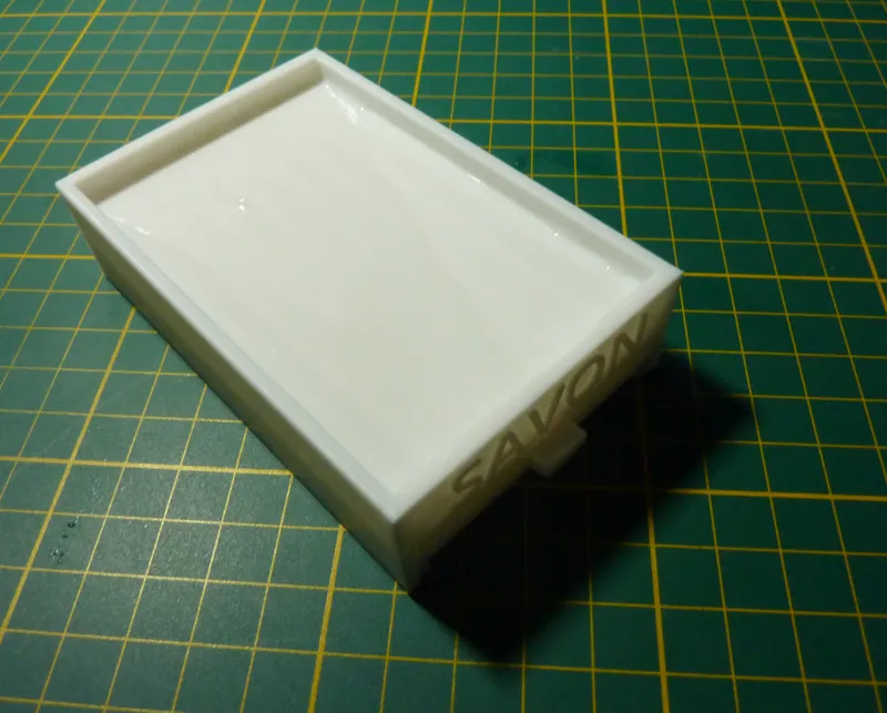 Porte savon avec réservoir d'eau