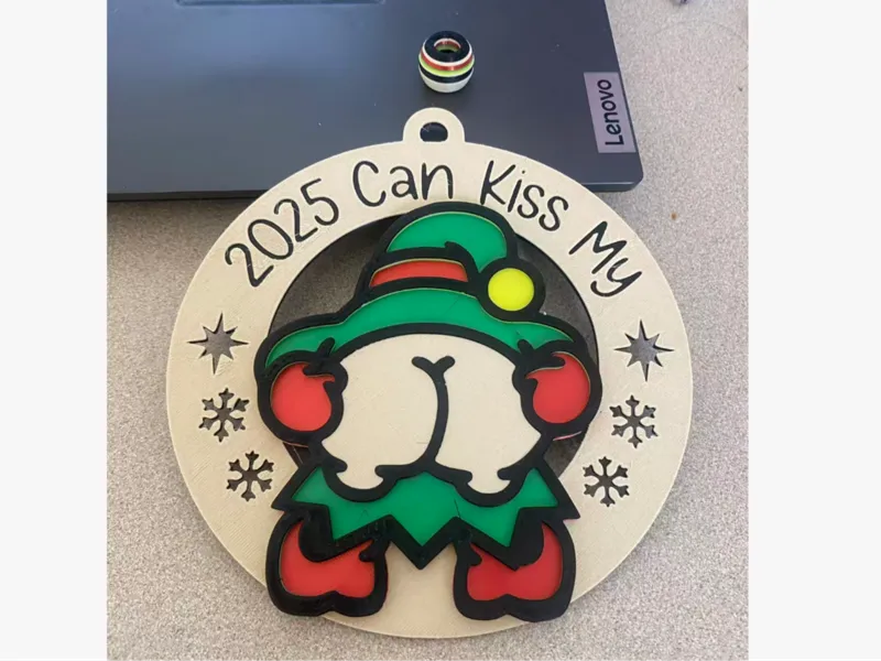 Santa’s Naughty Elf – “2025 Can Kiss My” Ornament