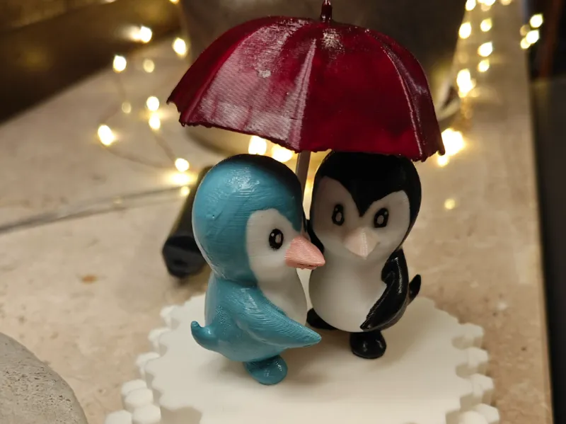Pinguine mit Regenschirm