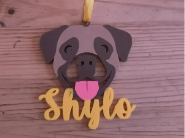 Adorno navideño con cara de Perro