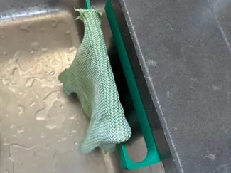 Kitchen sink rag holder