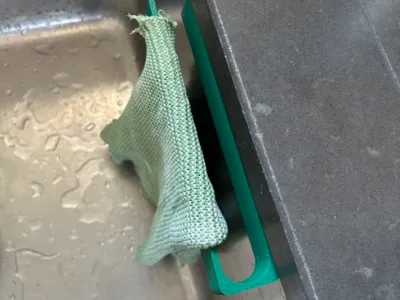 Kitchen sink rag holder