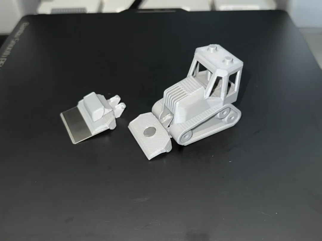 Racloir bulldozer pour plateau d'impression