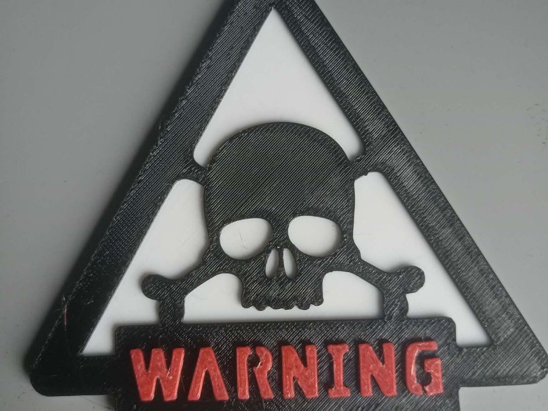 Warning sign with a skull