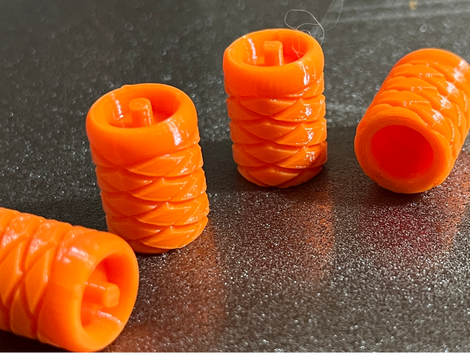 Tire valve stem cap with pressure bleed