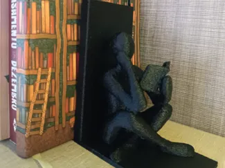 Apoio de livros A Leitora