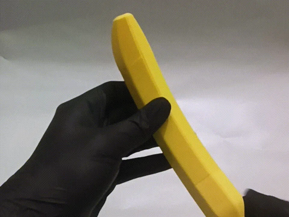 Banananife — Over-engineered OTF knife in banana view 2