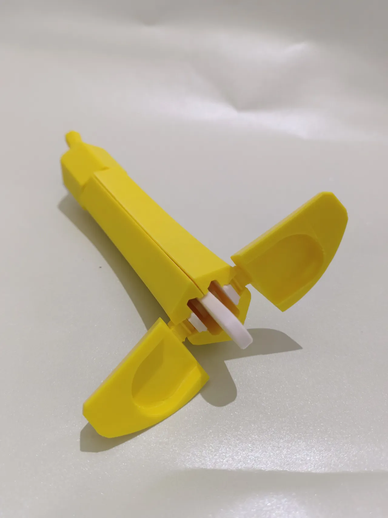 Banananife — Over-engineered OTF knife in banana view 4