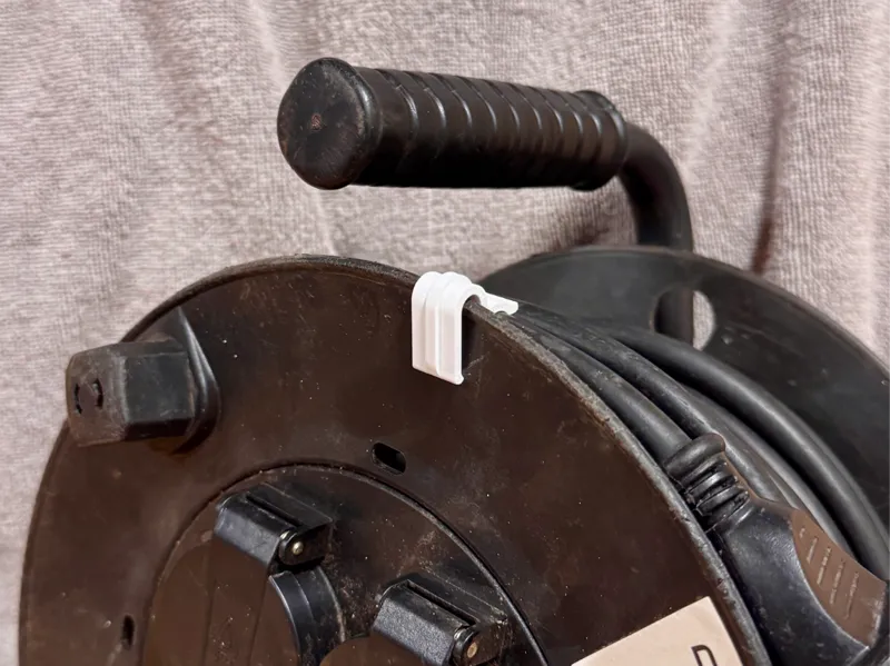Extension cord reel cable clip