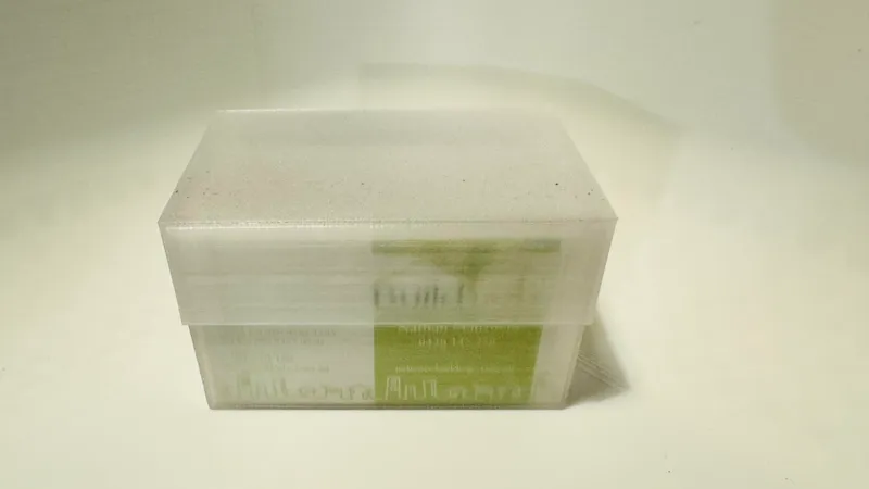 Business card holder with lid