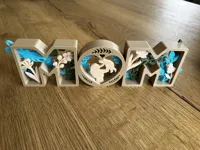 “MOM” lettering in a single color