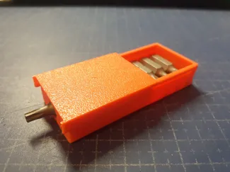 Keychain screwdriver with container for bits