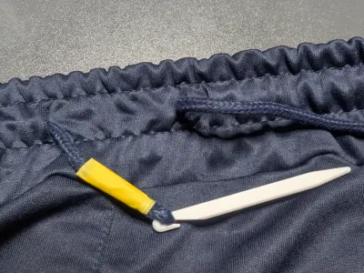 "Cord-pin" (to fix your gym shorts)