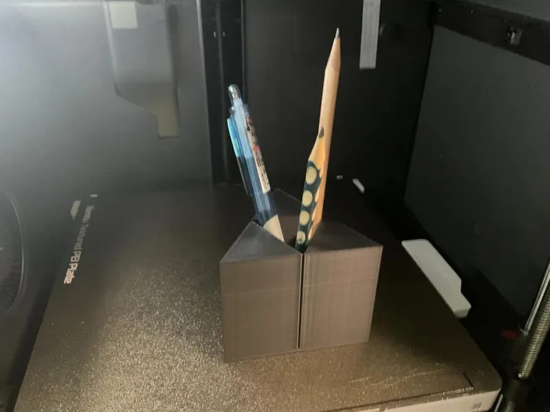 The triangle power pen holder