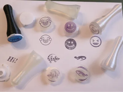 Stamps with interchangeable motives