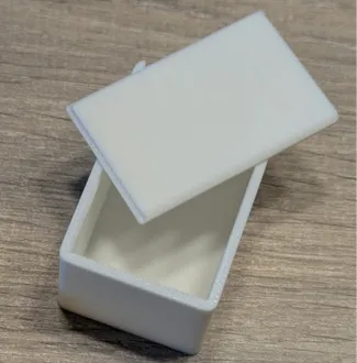 Box with rounded corners and sliding lid