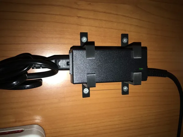 Support pour bloc d'alimentation d'ordinateur portable