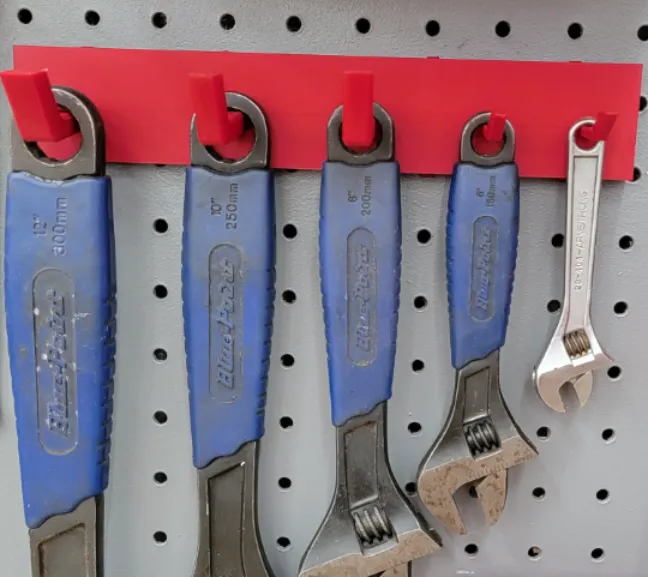 Crescent wrench holder for peg board