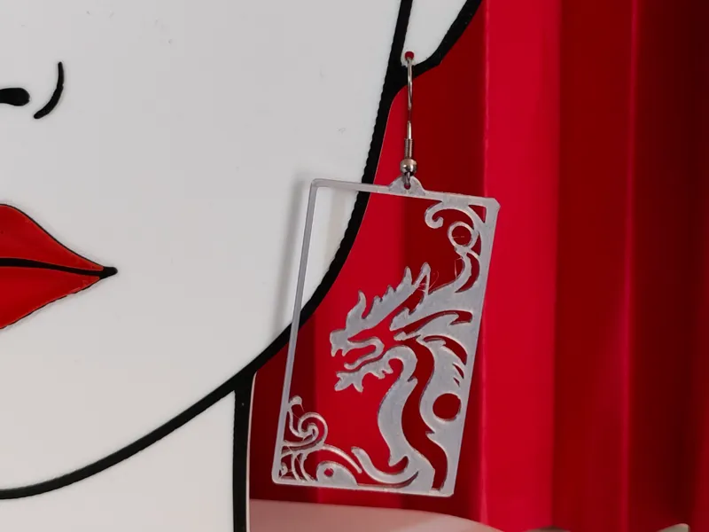 Dragon in frame earrings - openwork