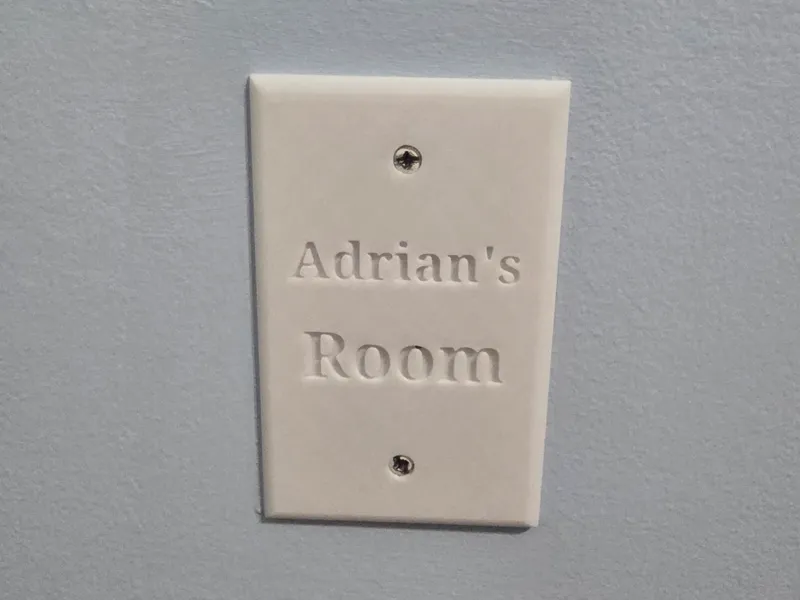 Wall outlet cover plate