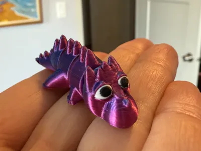 Articulated baby dragon fidget toy keychain