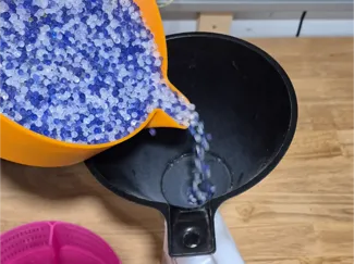 Desiccant tray funnel