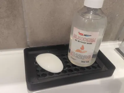 Draining soap dish with drainage hole