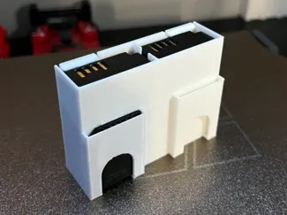 Camera battery and SD card holder w coin slot