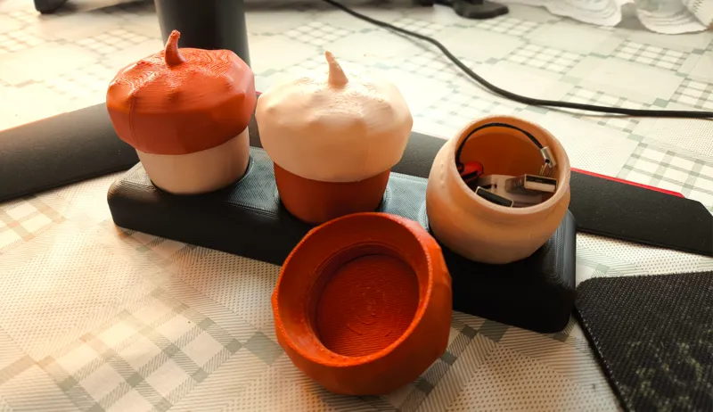 Acorn-shaped containers with threaded caps.
