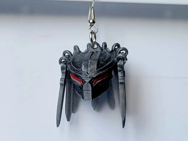 Predator earrings with articulated braids
