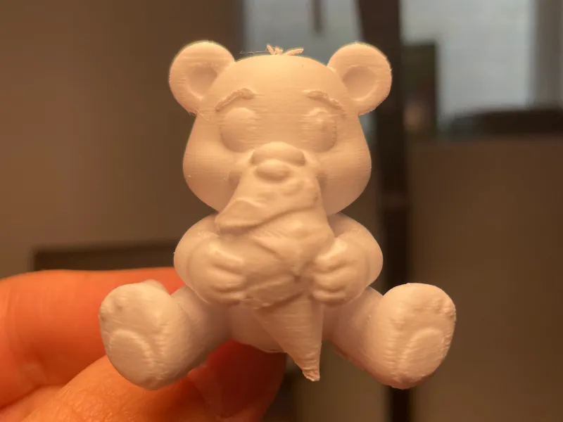 cute bear creature eating ice cream