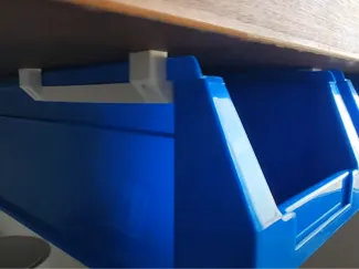 Stackable plastic drawer under table rails