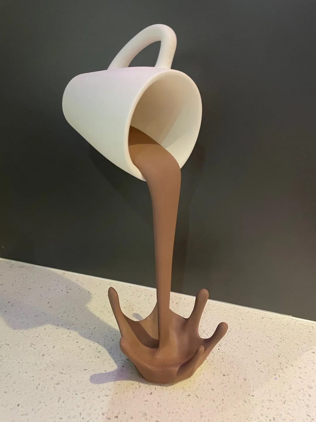 Floating coffee cup sculpture view 2