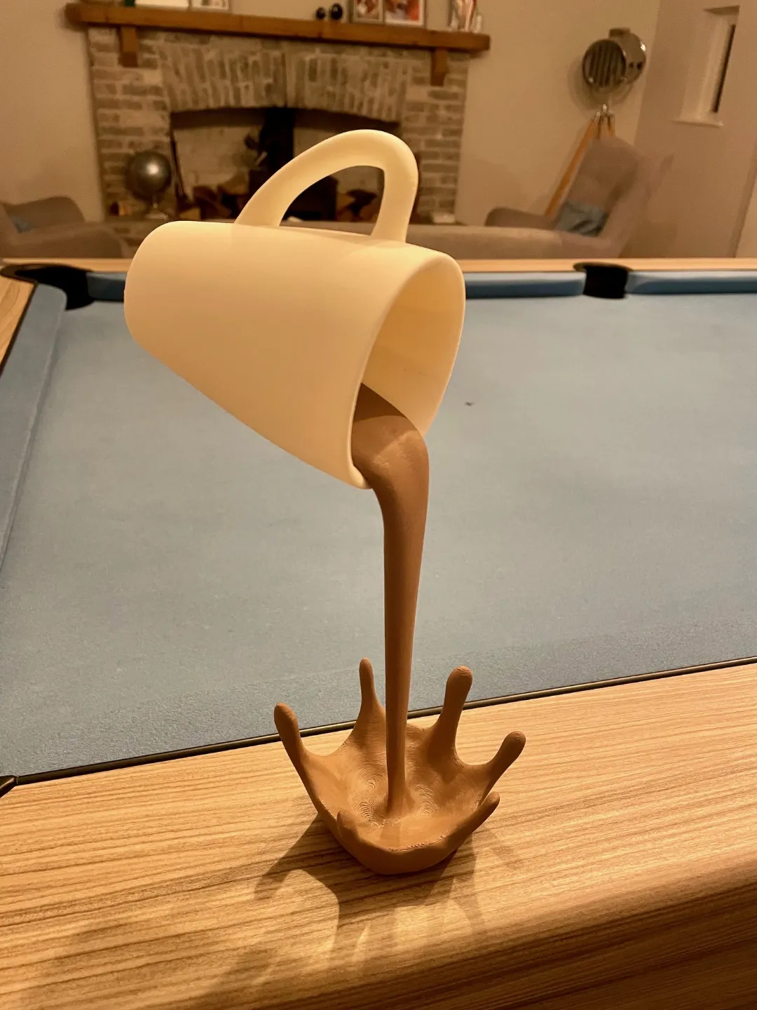 Floating coffee cup sculpture view 3