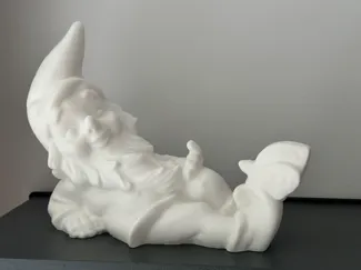 Lying gnome with a butterfly