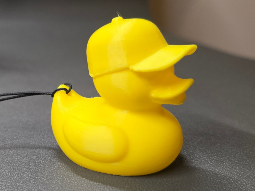 Cute duck wearing a baseball cap keychain 