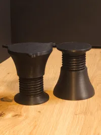 furniture feet with screw holes.
