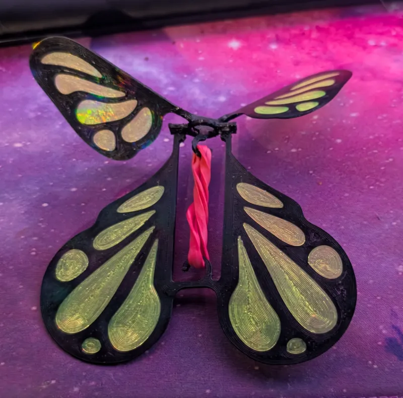 Rubber band powered flying butterfly prank