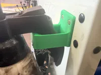 Pump spray holder for bottles with larger handles