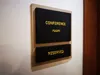Sliding wall-mounted office sign