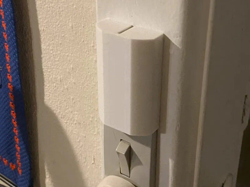 Light switch cover for narrow minitangent switch
