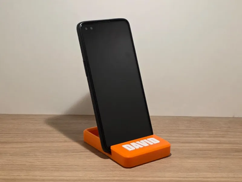 Phone holder with space for object, customizable