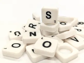 Scrabble letter tiles/rocks/stones