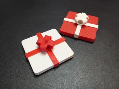 Low profile gift box with a ribbon