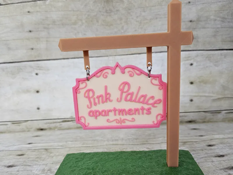 Coraline Pink Apartments Sign