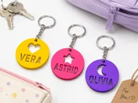 Customizable Round Name Keychains – 12 Variations
