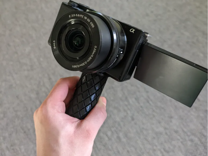 Camera handle for smaller cameras
